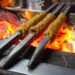 Aligarh Food Guide: Famous Dishes and Food Streets to Try Seekh kebabs cooking over a charcoal grill
