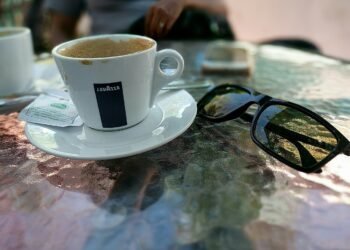 Two cups of coffee on a cafe table